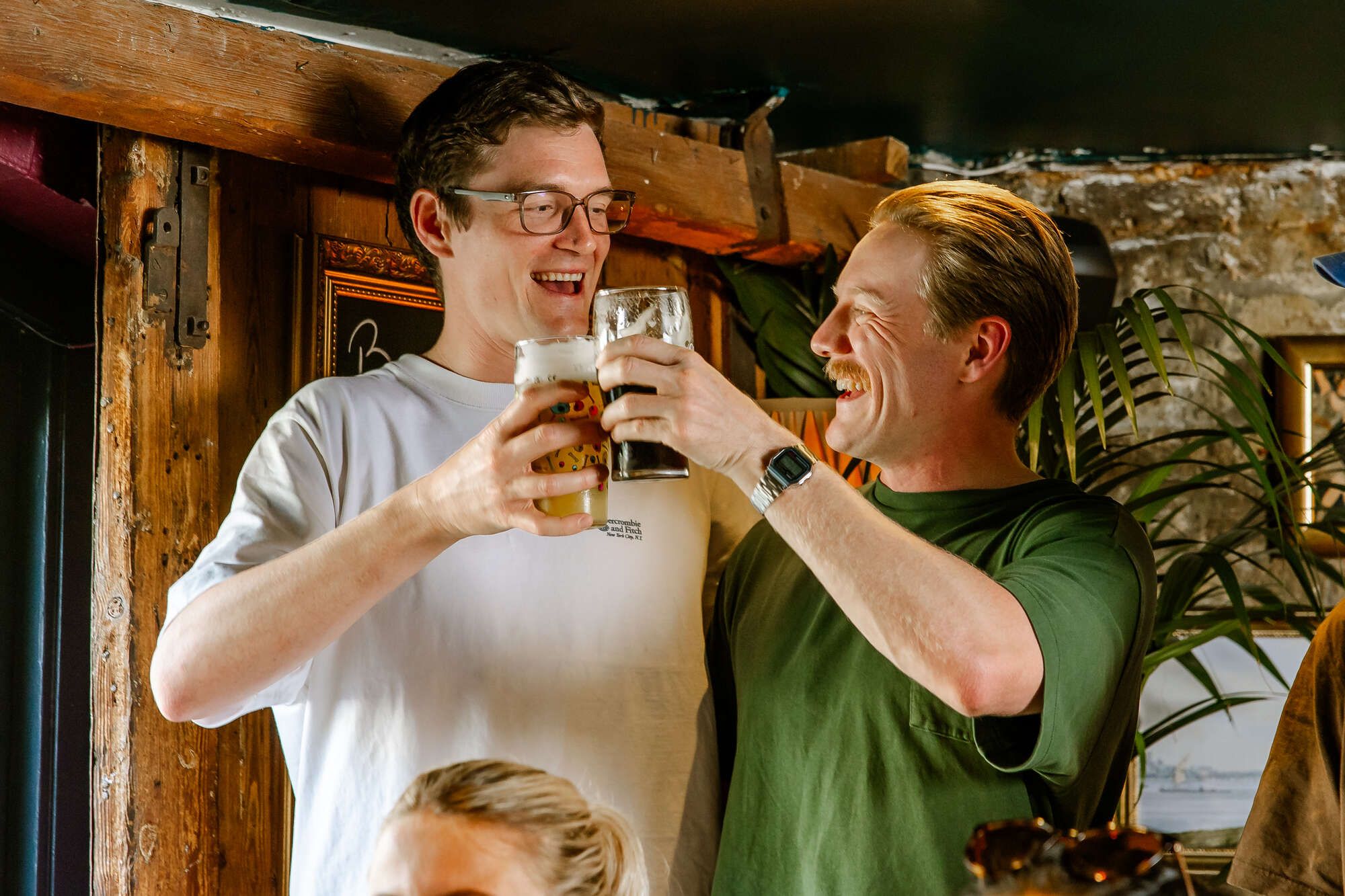 Friends saying cheers at The Duke of Wellington Notting Hill